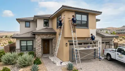 Professional house painters working on home exterior in Reno NV