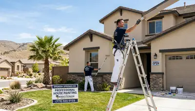 Professional house painters working on a residential exterior repaint in Reno, NV